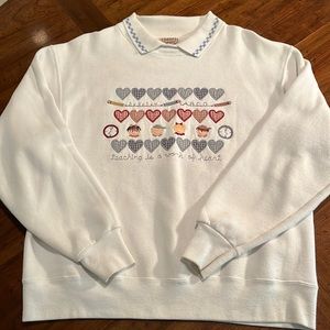 Teaching is a Work of Heart embroidered heavy-weight sweatshirt.